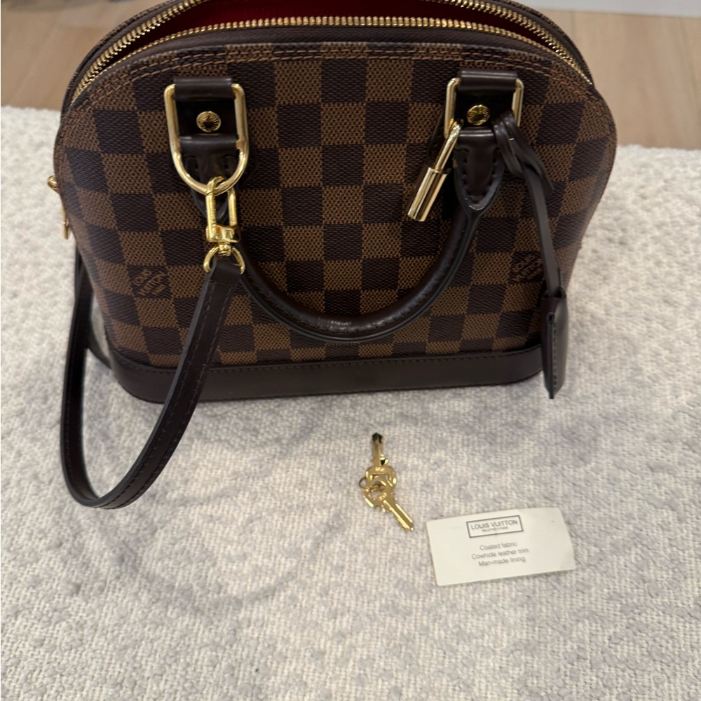 LOUIS VUITTON
Damier Ebene Alma BB